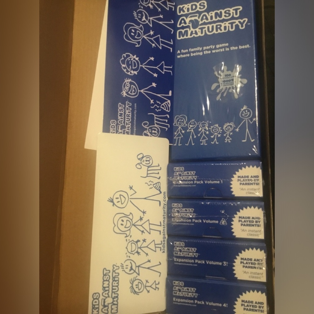 Kids against maturity core game and 4 expansion packs NIB